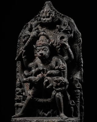 Lot 246 - A RARE BLACK STONE STELE OF NARASIMHA KILLING HIRANYAKASHIPU, PALA PERIOD