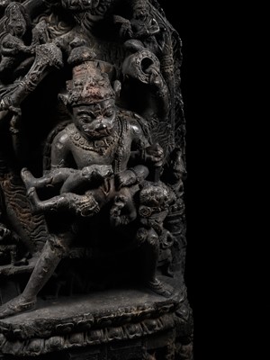 Lot 246 - A RARE BLACK STONE STELE OF NARASIMHA KILLING HIRANYAKASHIPU, PALA PERIOD