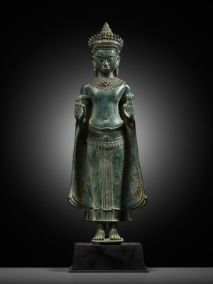 Lot 189 - A LARGE AND IMPORTANT BRONZE FIGURE OF A CROWNED BUDDHA, ANGKOR PERIOD, 12TH CENTURY