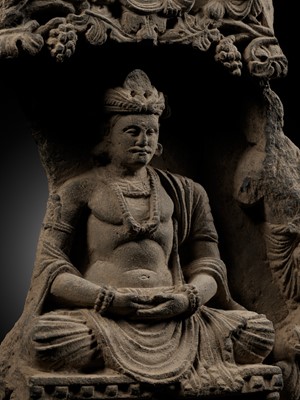 Lot 337 - A GRAY SCHIST STELE OF THE BODHISATTVA MAITREYA WITH A DEVOTEE, ANCIENT REGION OF GANDHARA, 3RD-4TH CENTURY