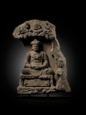 Lot 337 - A GRAY SCHIST STELE OF THE BODHISATTVA MAITREYA WITH A DEVOTEE, ANCIENT REGION OF GANDHARA, 3RD-4TH CENTURY