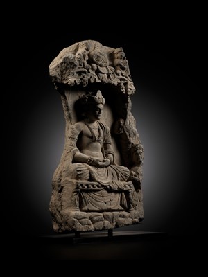 Lot 337 - A GRAY SCHIST STELE OF THE BODHISATTVA MAITREYA WITH A DEVOTEE, ANCIENT REGION OF GANDHARA, 3RD-4TH CENTURY