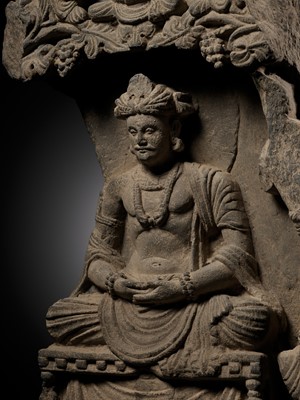 Lot 337 - A GRAY SCHIST STELE OF THE BODHISATTVA MAITREYA WITH A DEVOTEE, ANCIENT REGION OF GANDHARA, 3RD-4TH CENTURY