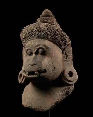 Lot 181 - A RARE AND MONUMENTAL SANDSTONE HEAD OF A GUARDIAN MONKEY, ANGKOR PERIOD, BANTEAY SREI STYLE