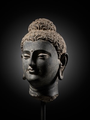 Lot 222 - A GRAY SCHIST HEAD OF BUDDHA, ANCIENT REGION OF GANDHARA, 2ND-3RD CENTURY