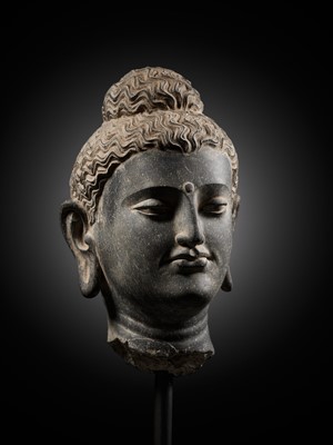 Lot 222 - A GRAY SCHIST HEAD OF BUDDHA, ANCIENT REGION OF GANDHARA, 2ND-3RD CENTURY