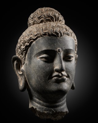 Lot 222 - A GRAY SCHIST HEAD OF BUDDHA, ANCIENT REGION OF GANDHARA, 2ND-3RD CENTURY
