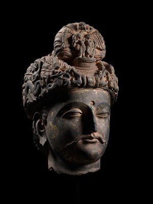 Lot 231 - A RARE GRAY SCHIST HEAD OF A BODHISATTVA WITH ‘GARUDA’ TURBAN CREST, ANCIENT REGION OF GANDHARA, 3RD-4TH CENTURY