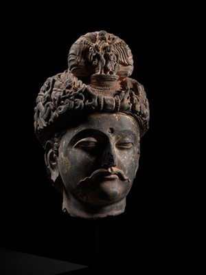 Lot 231 - A RARE GRAY SCHIST HEAD OF A BODHISATTVA WITH ‘GARUDA’ TURBAN CREST, ANCIENT REGION OF GANDHARA, 3RD-4TH CENTURY