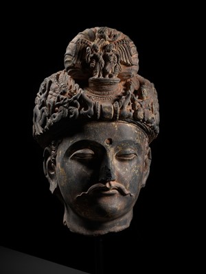 Lot 231 - A RARE GRAY SCHIST HEAD OF A BODHISATTVA WITH ‘GARUDA’ TURBAN CREST, ANCIENT REGION OF GANDHARA, 3RD-4TH CENTURY