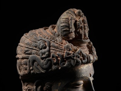 Lot 231 - A RARE GRAY SCHIST HEAD OF A BODHISATTVA WITH ‘GARUDA’ TURBAN CREST, ANCIENT REGION OF GANDHARA, 3RD-4TH CENTURY