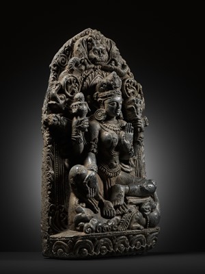A BLACK STONE STELE OF VARUNI, THE GODDESS OF WINE, NEPAL, 13TH CENTURY