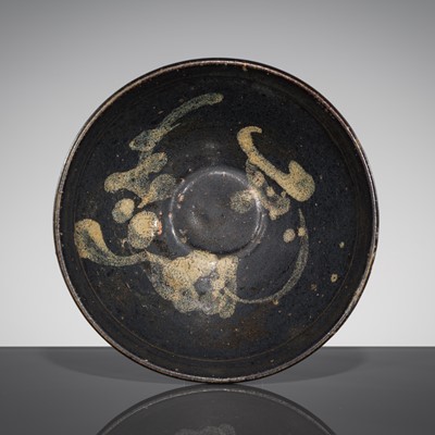 Lot 540 - A JIZHOU PAINTED BLACK-GLAZED ‘MOON AND PRUNUS’ BOWL, SONG DYNASTY