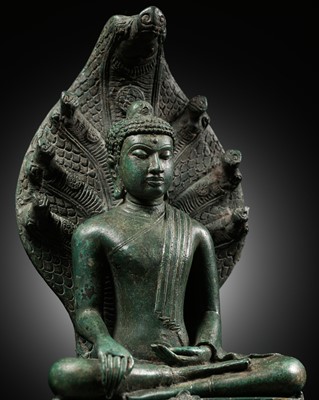 Lot 192 - A BRONZE FIGURE OF BUDDHA MUCHALINDA, SRIVIJAYA PERIOD