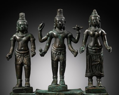 Lot 169 - A BRONZE TRIAD WITH LOKESHVARA, ANGKOR PERIOD