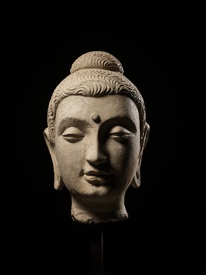A LARGE STUCCO HEAD OF BUDDHA, GANDHARA, 3RD CENTURY
