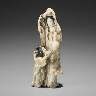 Lot 1967 - MASANOBU: AN IVORY OKIMONO OF KANNON WITH CHILD