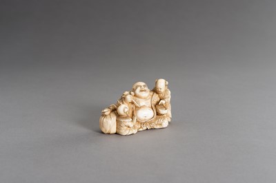 Lot 315 - CHIKAHIDE: AN IVORY OKIMONO OF HOTEI WITH TWO KARAKO