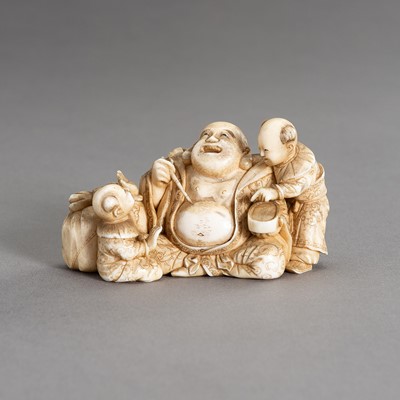 Lot 1966 - CHIKAHIDE: AN IVORY OKIMONO OF HOTEI WITH TWO KARAKO