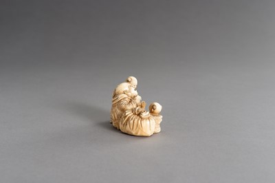 Lot 315 - CHIKAHIDE: AN IVORY OKIMONO OF HOTEI WITH TWO KARAKO