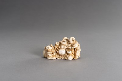 Lot 315 - CHIKAHIDE: AN IVORY OKIMONO OF HOTEI WITH TWO KARAKO