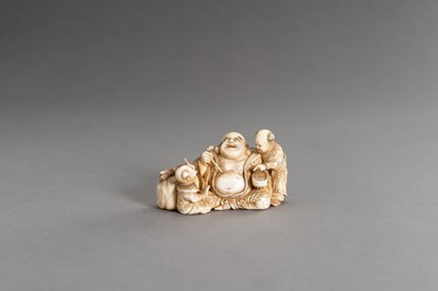 Lot 315 - CHIKAHIDE: AN IVORY OKIMONO OF HOTEI WITH TWO KARAKO