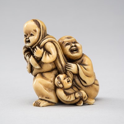 Lot 1275 - KOSEN: AN IVORY NETSUKE OF HOTEI IN HIS TREASURE BAG BEING PULLED BY A KARAKO, 19TH CENTURY