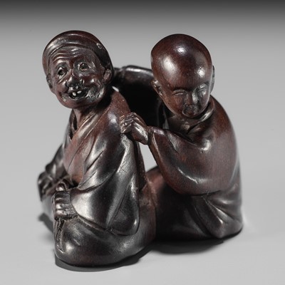 Lot 161 - MIWA: A FINE WOOD NETSUKE OF A BLIND MASSEUR AND CLIENT