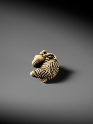 Lot 44 - A FINE MARINE IVORY NETSUKE OF A RECLINING GOAT