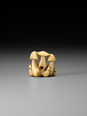 Lot 38 - YOSHITADA: A FINE IVORY NETSUKE OF A CLUSTER OF MUSHROOMS