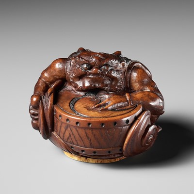 OSAI: A WOOD OKIMONO OF RAIJIN DISCHARGING A STORM