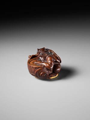 Lot 317 - OSAI: A WOOD OKIMONO OF RAIJIN DISCHARGING A STORM
