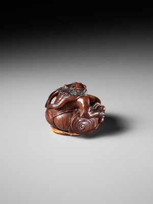 Lot 317 - OSAI: A WOOD OKIMONO OF RAIJIN DISCHARGING A STORM