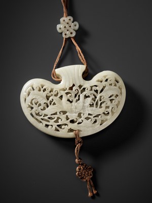 Lot 172 - A WHITE JADE RETICULATED POUCH-FORM POMANDER, QING DYNASTY