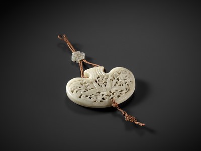 Lot 172 - A WHITE JADE RETICULATED POUCH-FORM POMANDER, QING DYNASTY