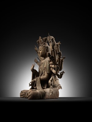 Lot 45 - A RARE WOOD FIGURE OF MULTI-ARMED GUANYIN, MING DYNASTY