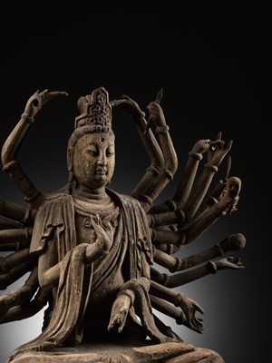 Lot 45 - A RARE WOOD FIGURE OF MULTI-ARMED GUANYIN, MING DYNASTY