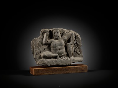 Lot 330 - A GRAY SCHIST FIGURE OF ATLAS, ANCIENT REGION OF GANDHARA, 2ND-3RD CENTURY
