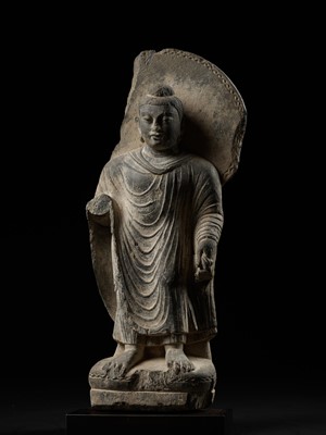 Lot 101 - A PUBLISHED GRAY SCHIST FIGURE OF BUDDHA SHAKYAMUNI, ANCIENT REGION OF GANDHARA, 3RD-4TH CENTURY
