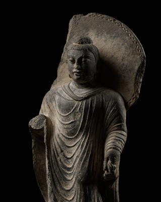 Lot 101 - A PUBLISHED GRAY SCHIST FIGURE OF BUDDHA SHAKYAMUNI, ANCIENT REGION OF GANDHARA, 3RD-4TH CENTURY