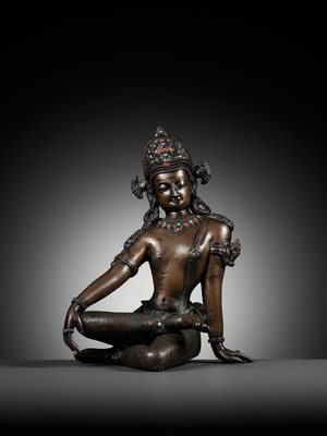 Lot 24 - A CORAL AND TURQUOISE-INLAID BRONZE FIGURE OF INDRA, NEPAL, 19TH CENTURY