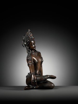 Lot 24 - A CORAL AND TURQUOISE-INLAID BRONZE FIGURE OF INDRA, NEPAL, 19TH CENTURY