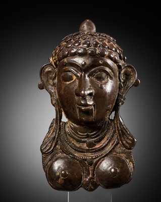 Lot 258 - A BRONZE PROCESSIONAL MASK, MOHRA, DEPICTING LAKSHMI, 17TH-18TH CENTURY