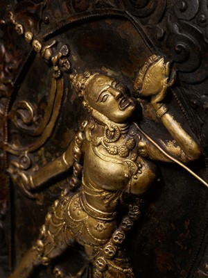 Lot 285 - A GILT COPPER REPOUSSÉ PLAQUE OF VAJRAYOGINI, TIBET, 18TH-19TH CENTURY