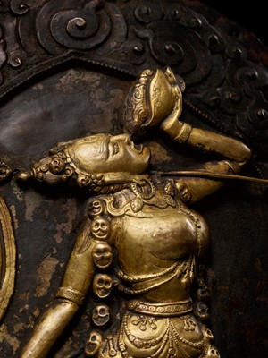 Lot 285 - A GILT COPPER REPOUSSÉ PLAQUE OF VAJRAYOGINI, TIBET, 18TH-19TH CENTURY