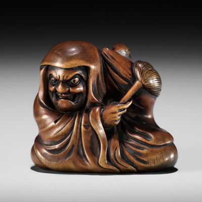 Lot 154 - SENGYOKU: AN AMUSING WOOD NETSUKE OF DARUMA DISTURBED IN HIS MEDITATION