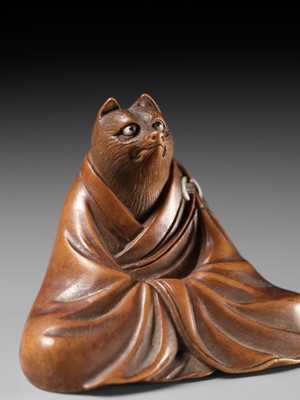 Lot 59 - ANRAKU: A FINE AND HUMOROUS WOOD NETSUKE OF TANUKI DISGUISED AS A PRIEST