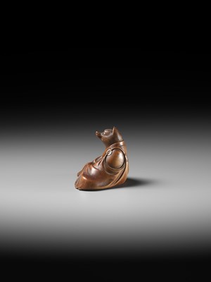 Lot 59 - ANRAKU: A FINE AND HUMOROUS WOOD NETSUKE OF TANUKI DISGUISED AS A PRIEST