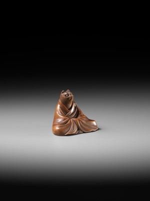 Lot 59 - ANRAKU: A FINE AND HUMOROUS WOOD NETSUKE OF TANUKI DISGUISED AS A PRIEST