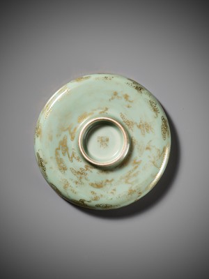 A RARE CELADON-GLAZED POLYCHROME-ENAMELED AND GILT-DECORATED ‘HAN YU’ DISH, QIANLONG MARK AND POSSIBLY OF THE PERIOD